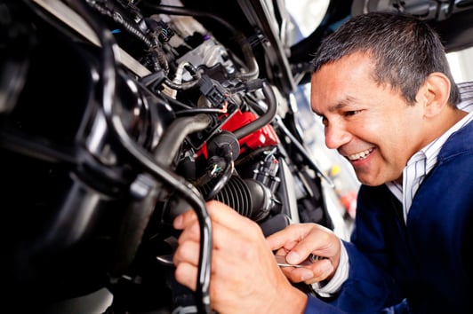 Car mechanic working at the auto repair shop