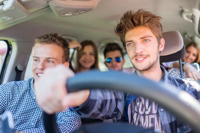 Young people having vacation enjoying fun driving car-1
