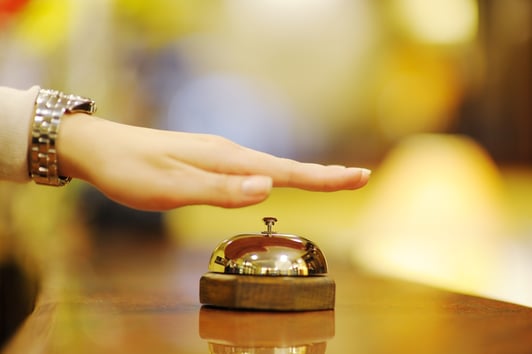 business woman  at the reception of a hotel checking in