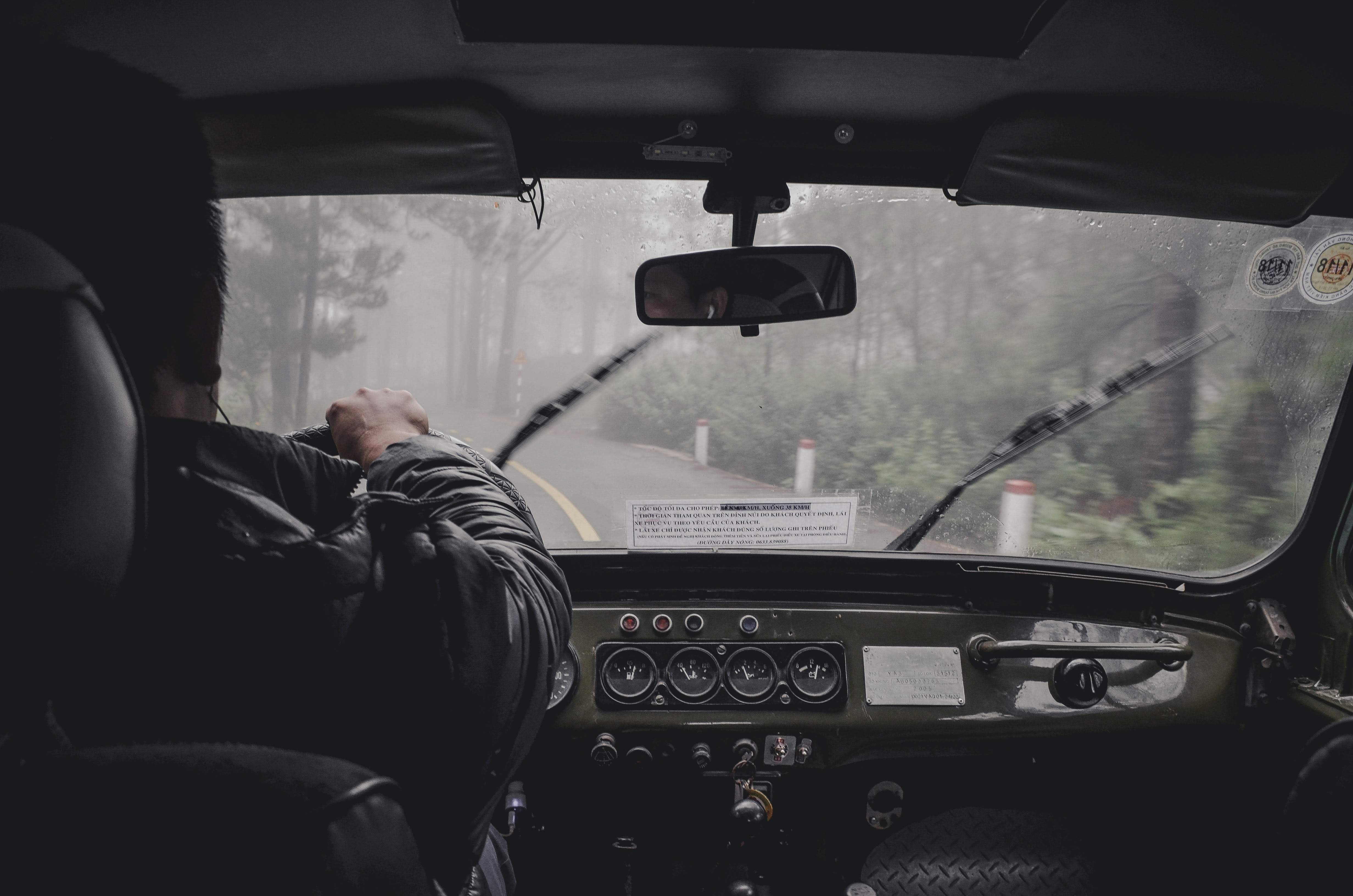 Man driving in heavy rain.